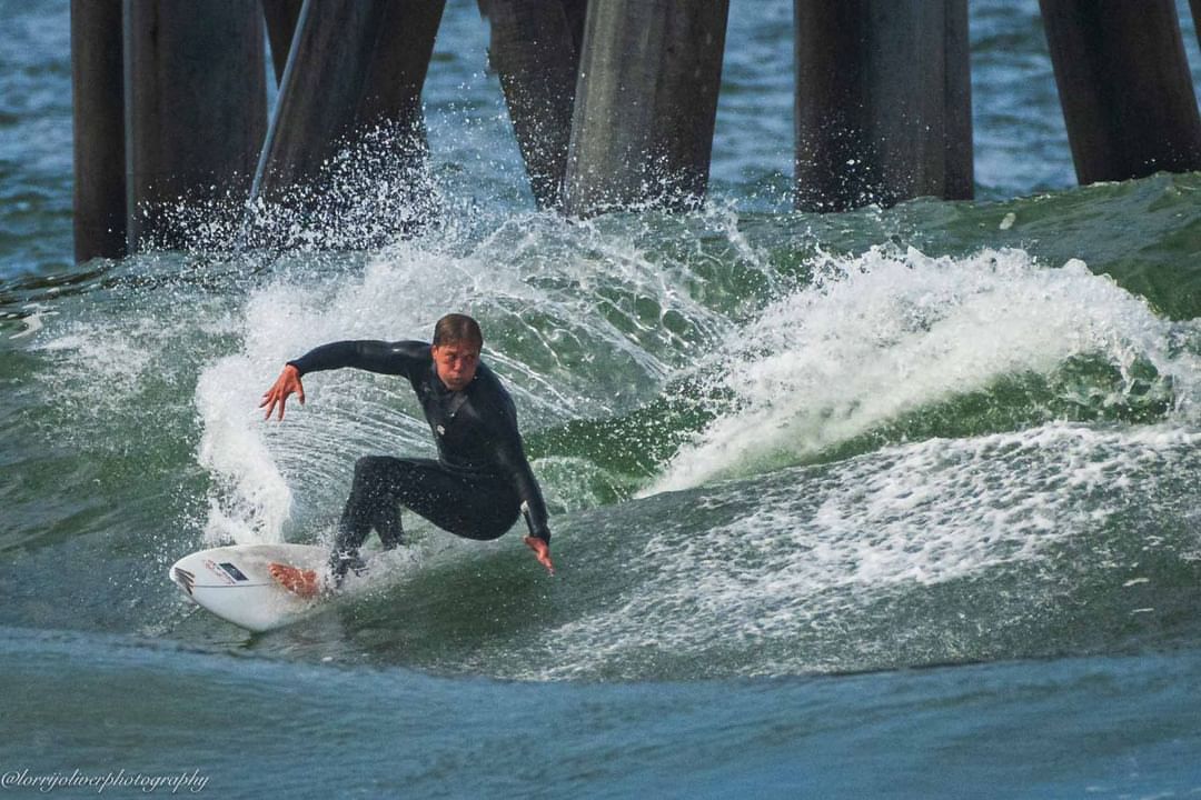 Bjorn surfing by the pier