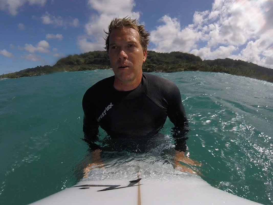 Bjorn on his surfboard in the ocean