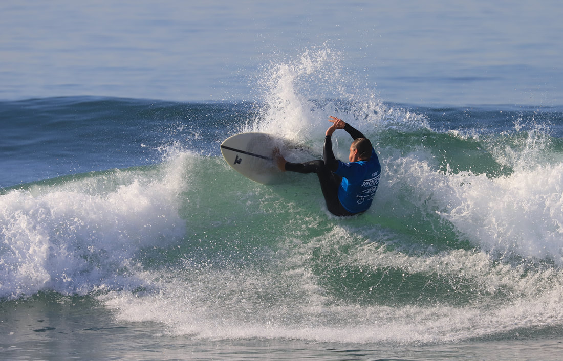 Bjorn competing in professional surfing